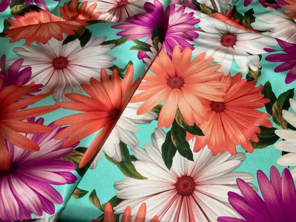 Italian Silk fabric Alta Moda with large flowers in turquoise background.Has some stretch.