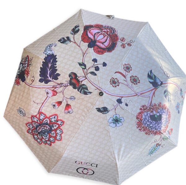Designer G umbrella with a flowers