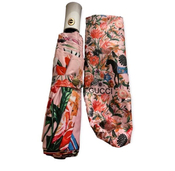 Designer G umbrella with a flowers and horses