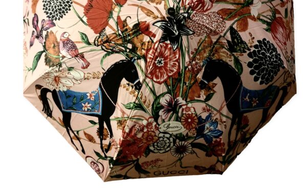 Designer G umbrella with a flowers and horses